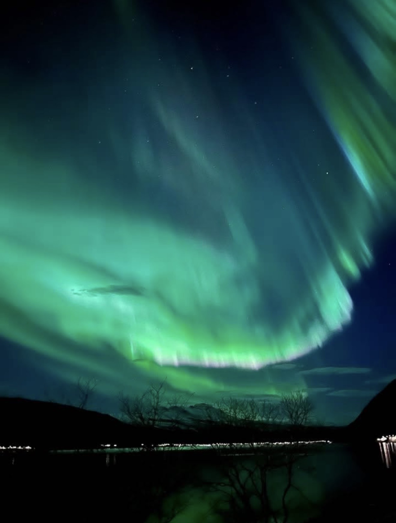Northern lights over the winter sky in Lavangen