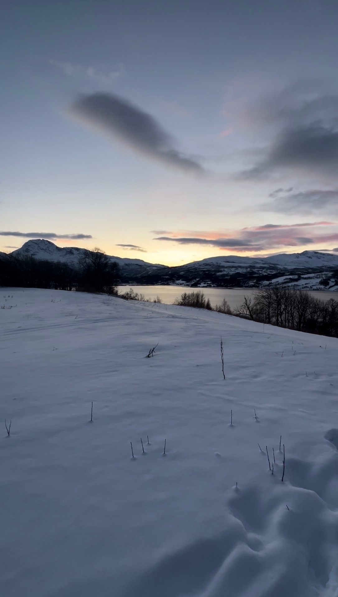 Winter fjord landscape in Lavangen at dusk